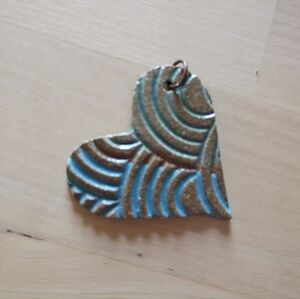 Heart-Shaped Pendant with Blue and Brown Design